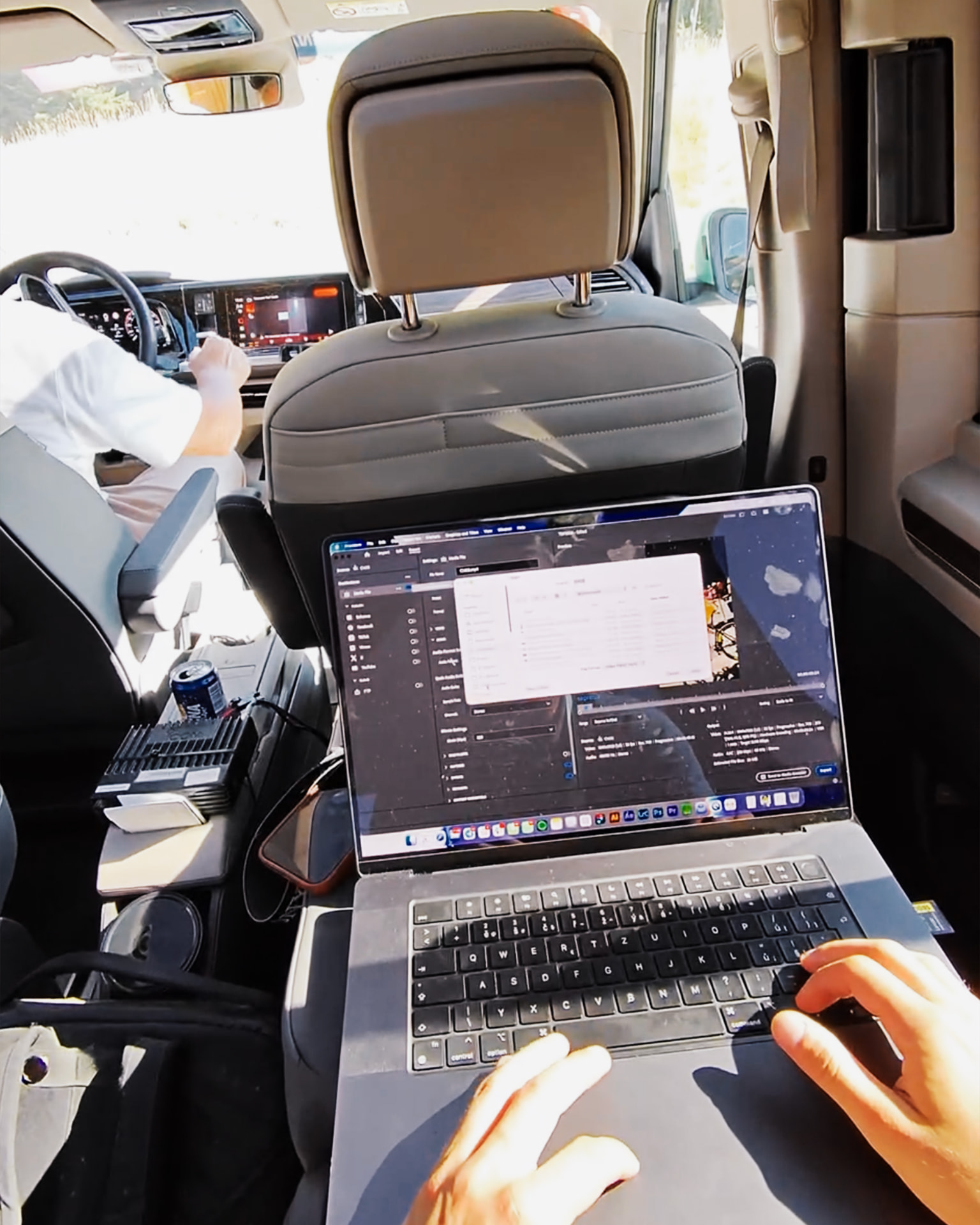 LAPTOP ON KNEES, VAN INTERIOR — ROUGH BTS